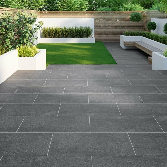 Inviting garden area featuring modern granite outdoor tiles