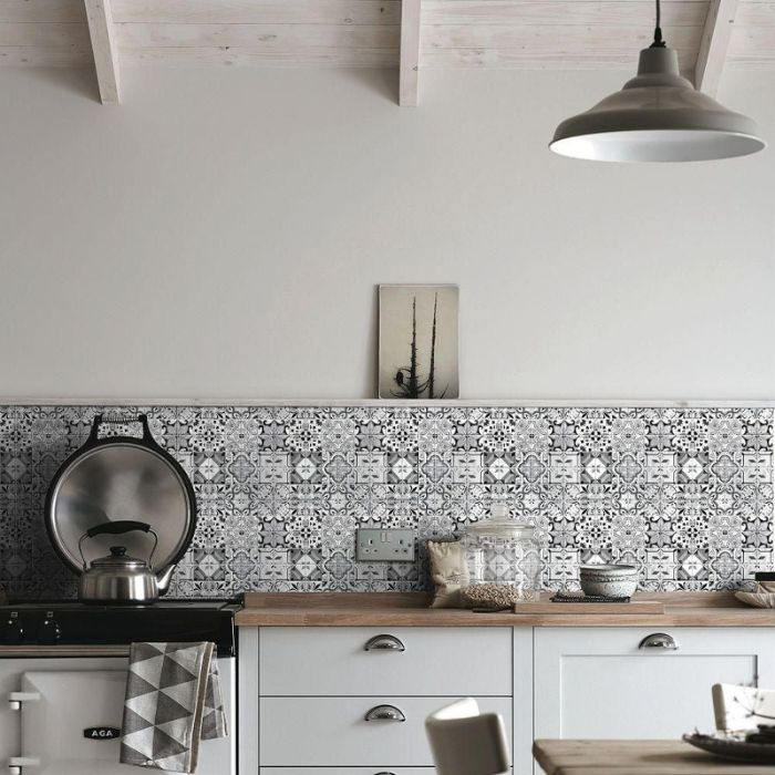 Stylish monochrome kitchen design accented by beautiful Moroccan tile work