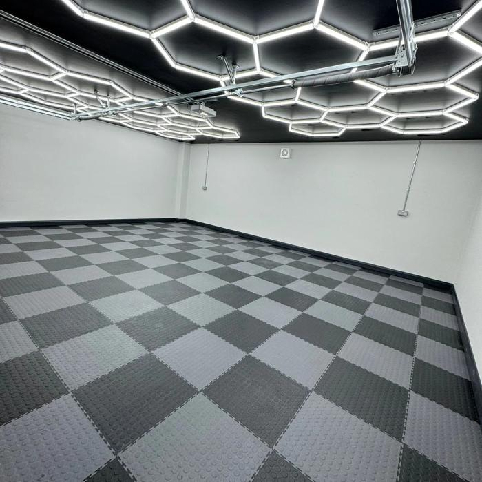 Interior garage view featuring a striking black and white checkered floor pattern