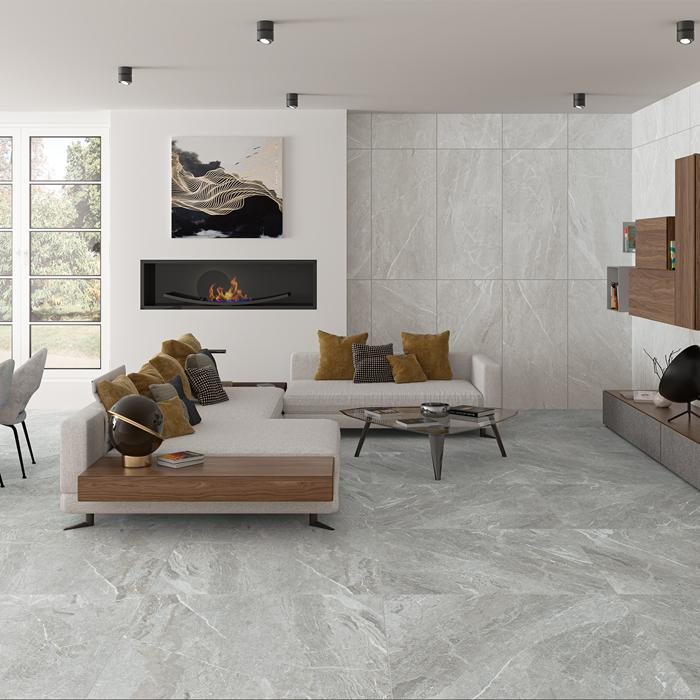 A modern living room featuring stylish stone effect tiles