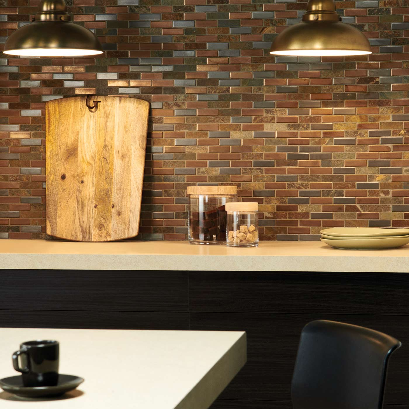 Warm brown mosaic tiles lining a sleek kitchen splashback