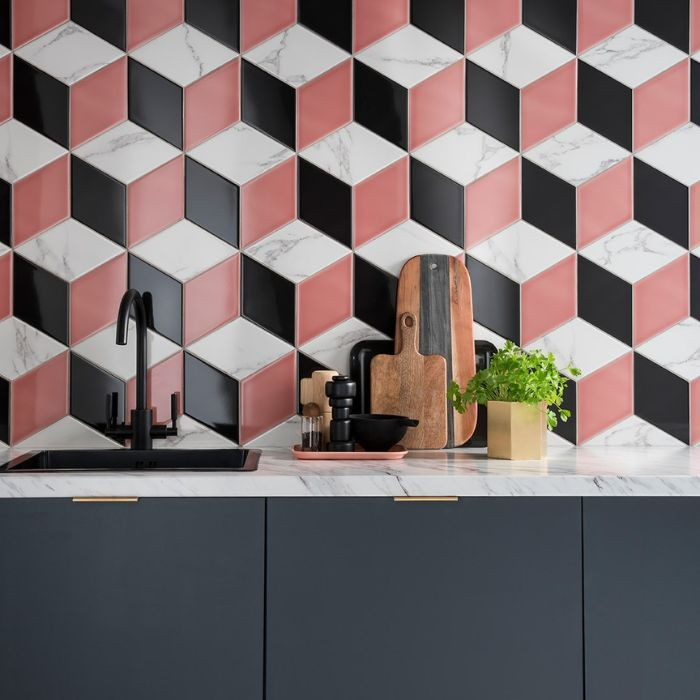 Modern kitchen with vibrant pink and black 3D tiles