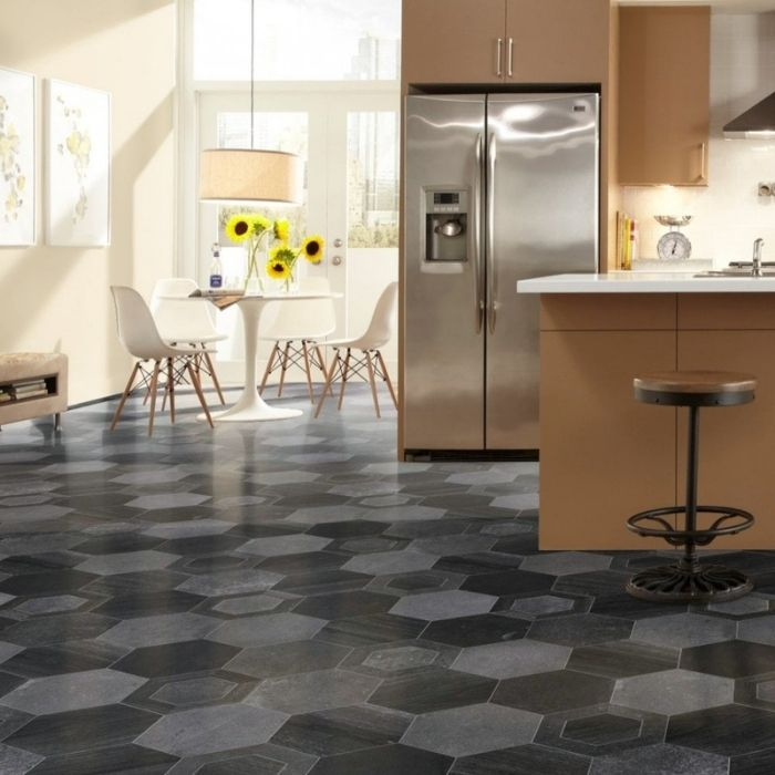 A sleek kitchen setting highlighted by a bold black and white tiled floor 