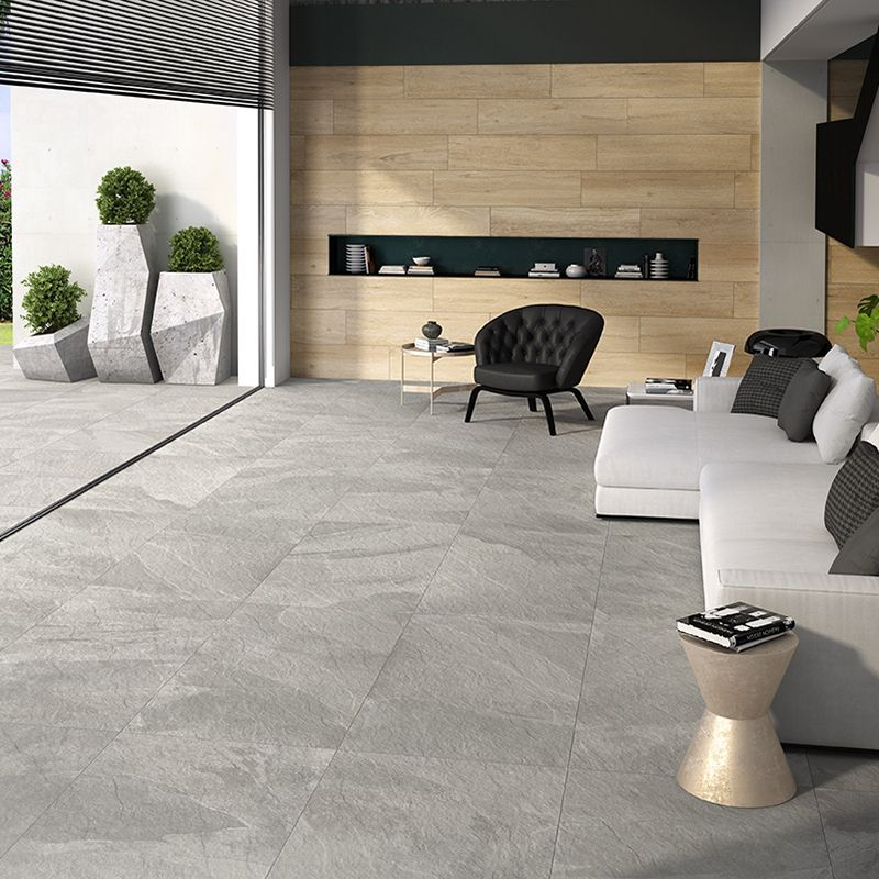 Modern living room with sleek grey floor tiles