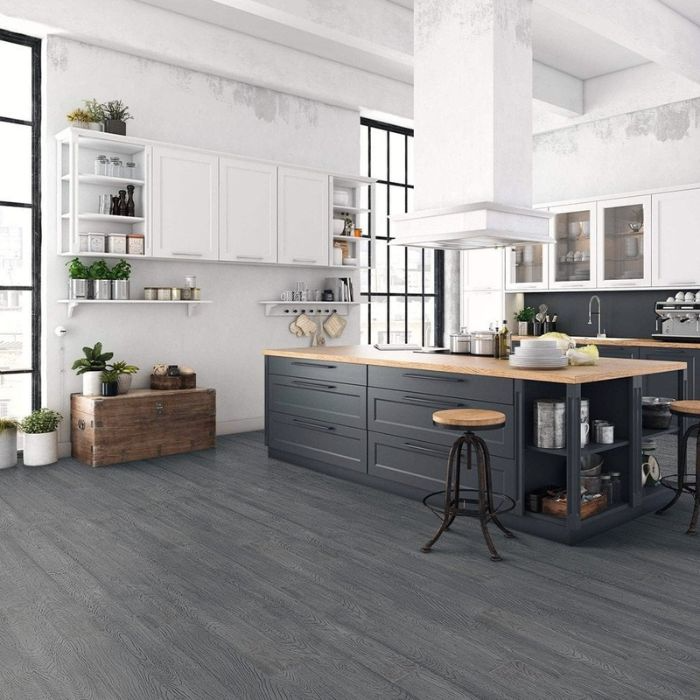 Minimalistic kitchen with sleek grey bamboo floors and bright white walls