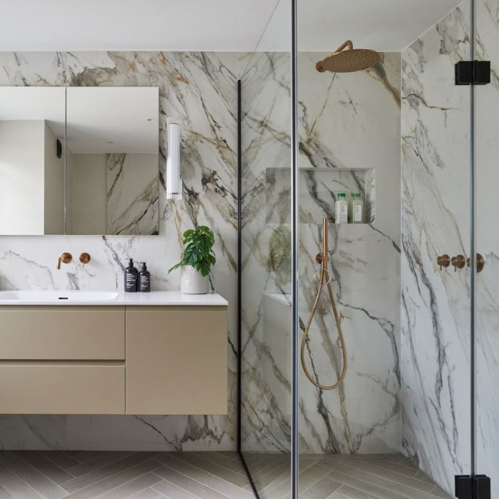 Luxurious marble bathroom interior with glass shower