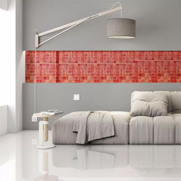 A stylish living room featuring a vibrant red tiled wall adorned with mosaic patterns