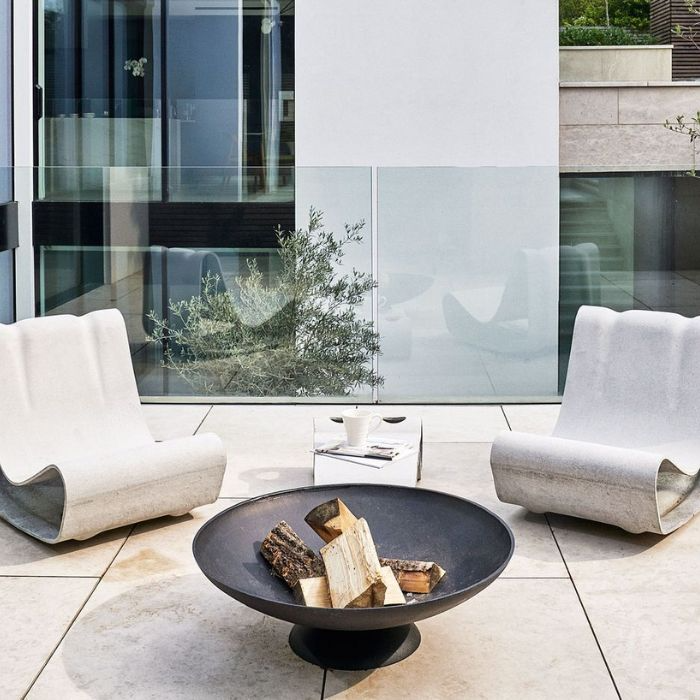 Outdoor fire pit surrounded by elegant patio tiles