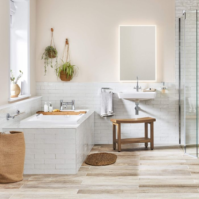 Stylish bathroom with wooden floor and white tiles