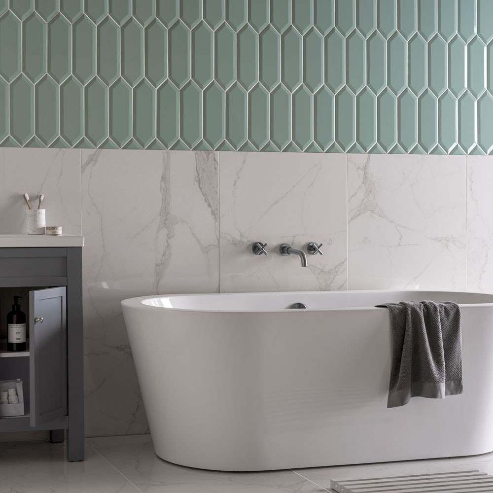 Modern bathroom with vibrant green tiles.