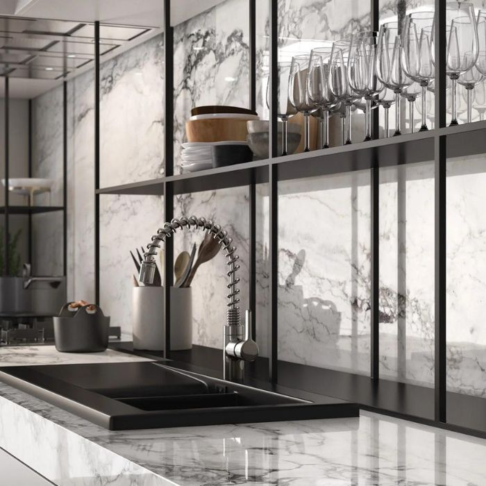 Modern black and white kitchen featuring luxurious marble finishes