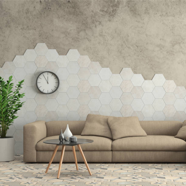 A cosy living room featuring a beige couch against stunning hexagon wall tiles