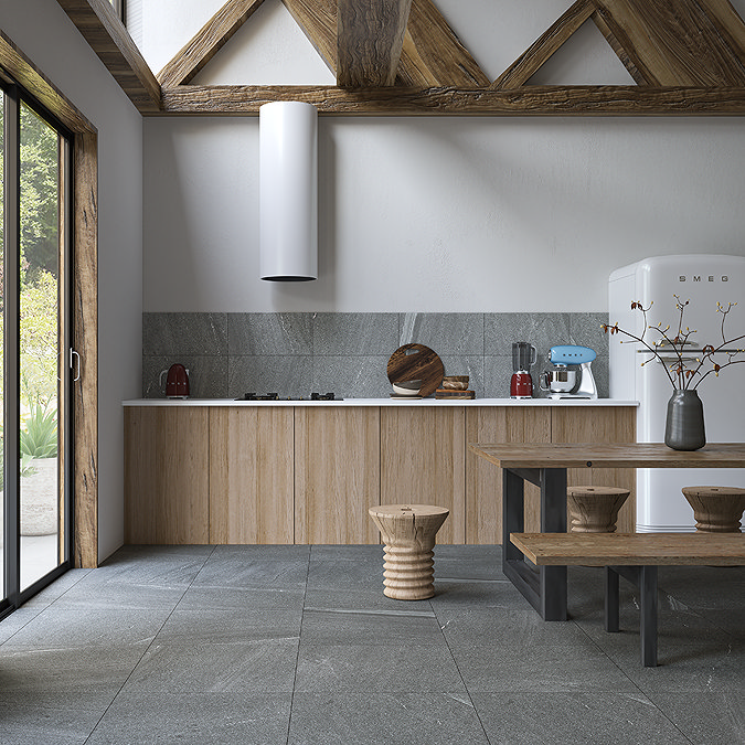 Wooden beams and bench in rustic kitchen with stone-effect floor tiles