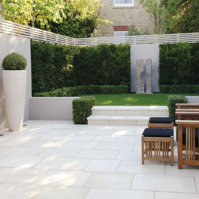 Al fresco dining setup on a pristine white patio surface