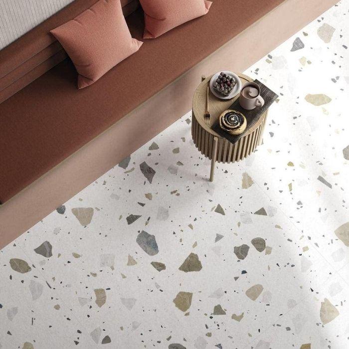 Top view of living room with white terrazzo floor tiles and a wooden coffee table