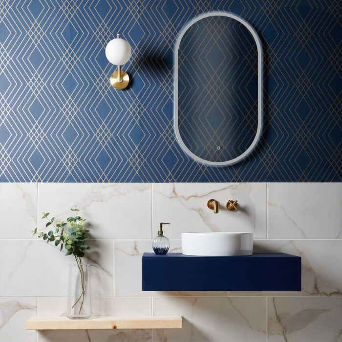 Modern bathroom design featuring stylish blue and gold accents