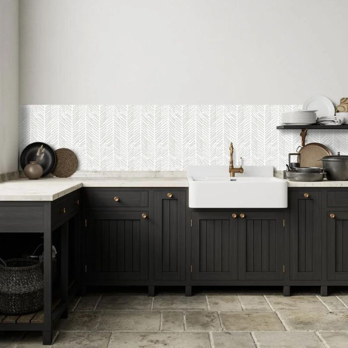 Stylish white kitchen with sleek black cabinets and sink