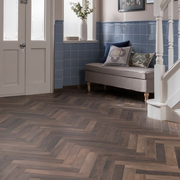 Sophisticated wooden-floored hallway with blue tiled walls