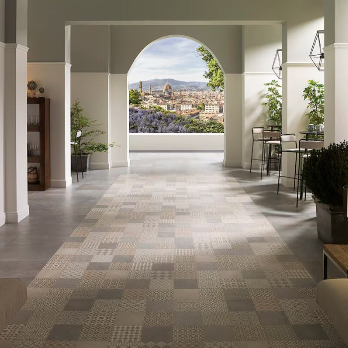 Moroccan tiles line the floor of a hallway overlooking a bustling cityscape