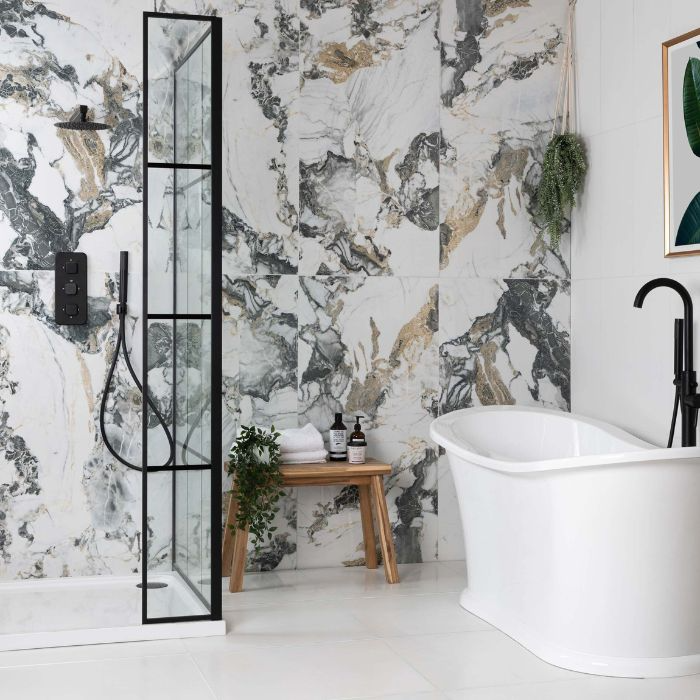 A sleek bathroom featuring a striking black and white marble wall