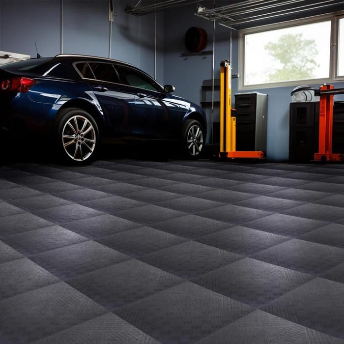 A stylish black car showcased against a clean garage floor