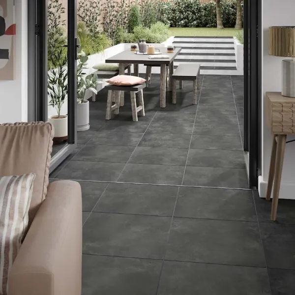 Alfresco dining setup on modern grey tiled patio