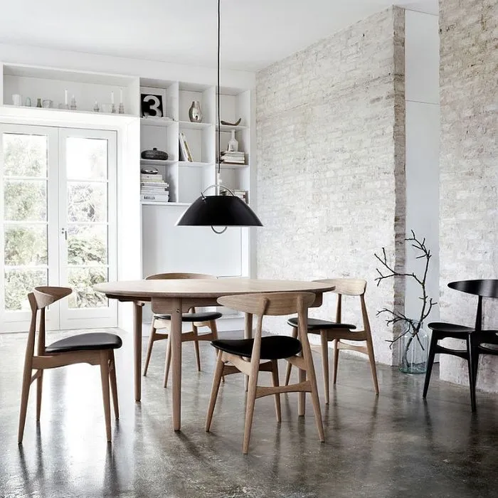 Bright dining room with a wooden table and chairs