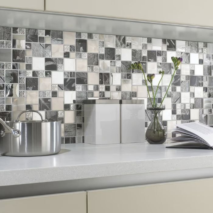 Stylish black and white mosaic tile backsplash in modern kitchen