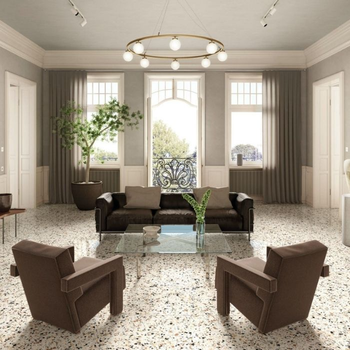 Elegant living room with white terrazzo floor tiles, brown furniture, and large windows