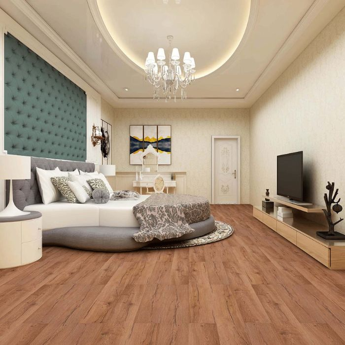 Serene bedroom featuring a large inviting bed on wooden flooring