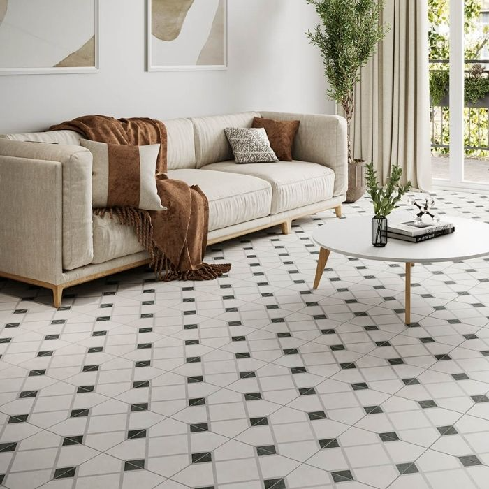 Living room with beige sofa and geometric patterned floor tiles