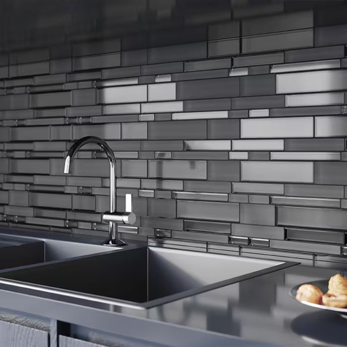 Modern kitchen with stainless steel sink and textured glass tile backsplash