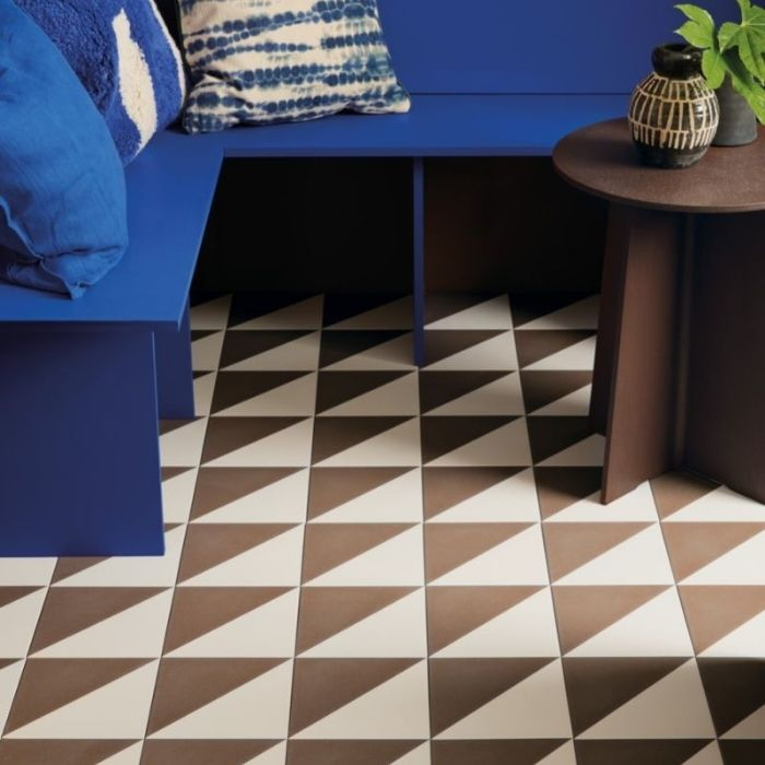 Living room with brown and white triangle patterned floor tiles