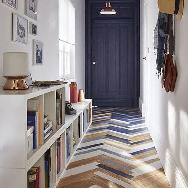 Herringbone patterned floor tiles in a chic hallway setting