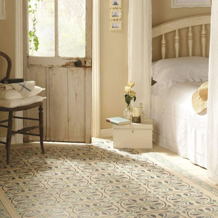 Elegant bedroom decor with white bed and rug, accented by Moroccan tile patterns