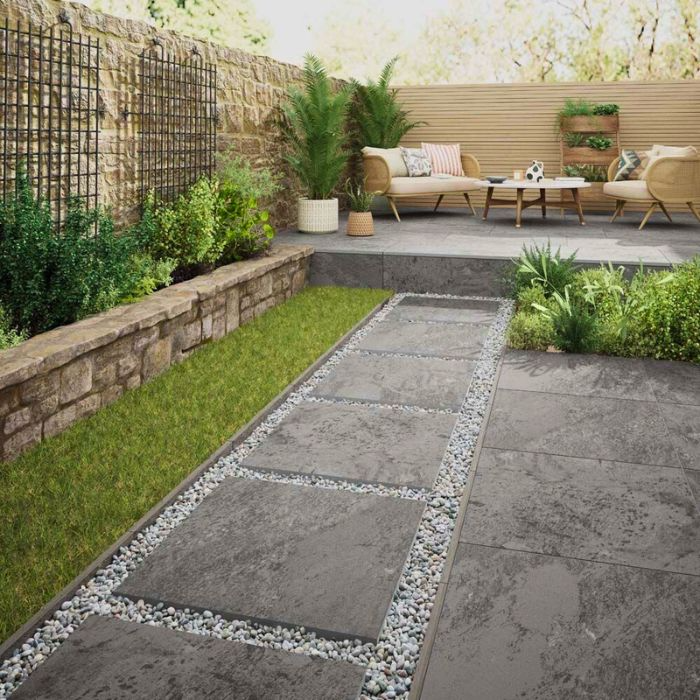 Elegant outdoor space featuring stone tile walkway and modern garden seating