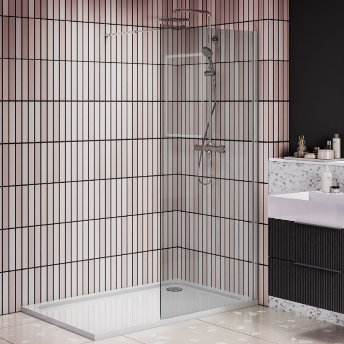 Contemporary bathroom design with a glass shower enclosure and eye-catching decorative tile work