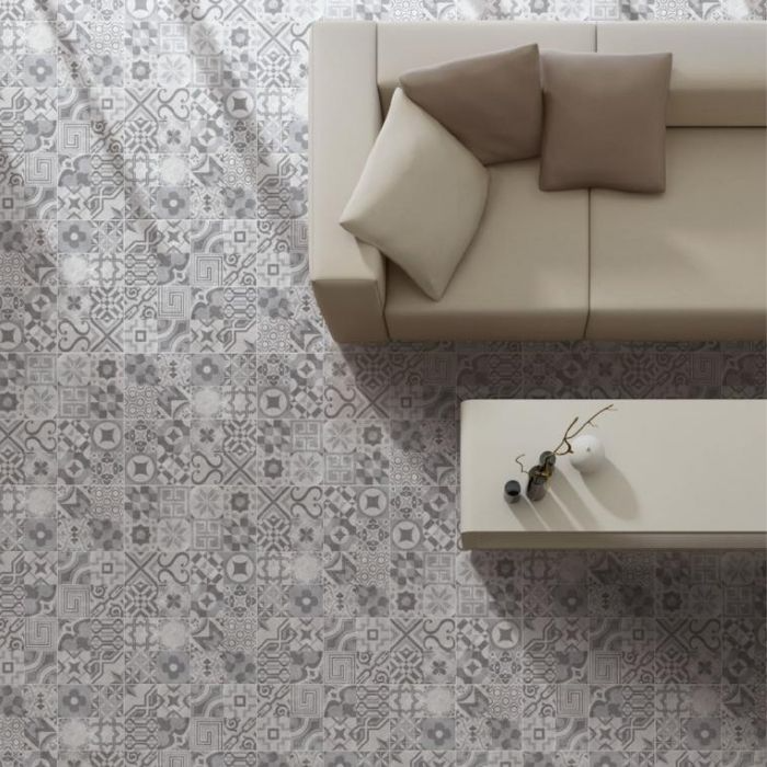 Living room with grey patterned floor tiles and a view of the city