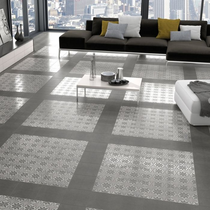 Living room with grey patterned floor tiles and beige furniture