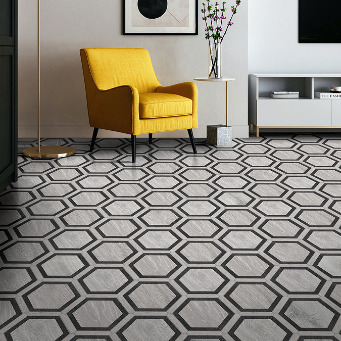 Living room with grey hexagon floor tiles and a yellow chair