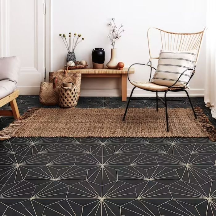 Living room with black patterned hexagon floor tiles and wicker furniture