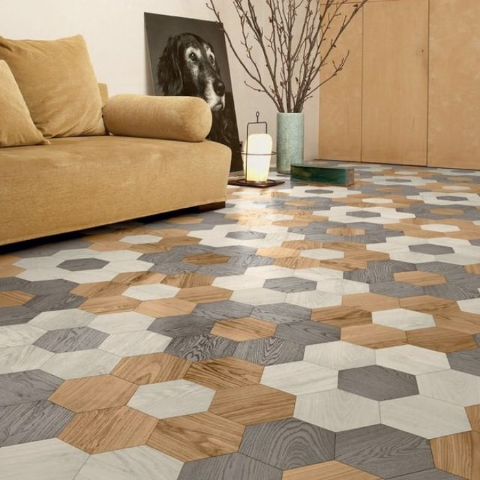 Living room with multicoloured hexagon floor tiles and a yellow sofa