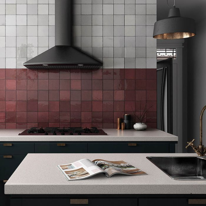 Modern kitchen decor featuring vibrant burgundy tiles