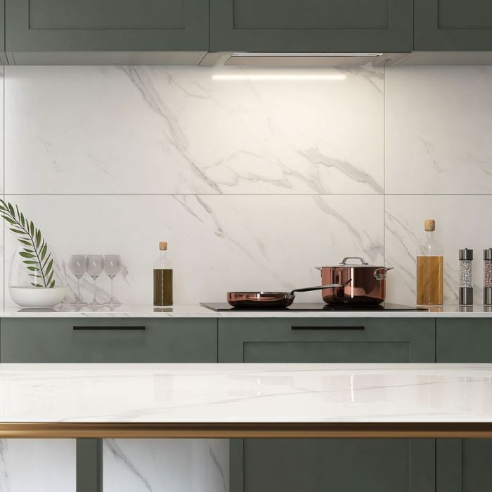 Stylish white kitchen featuring luxurious marble countertops