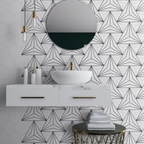 Black and white tiled bathroom with stylish geometric patterns and a sleek mirror