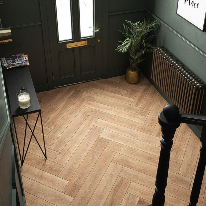 A charming hallway blending rich green tones with natural wood textures