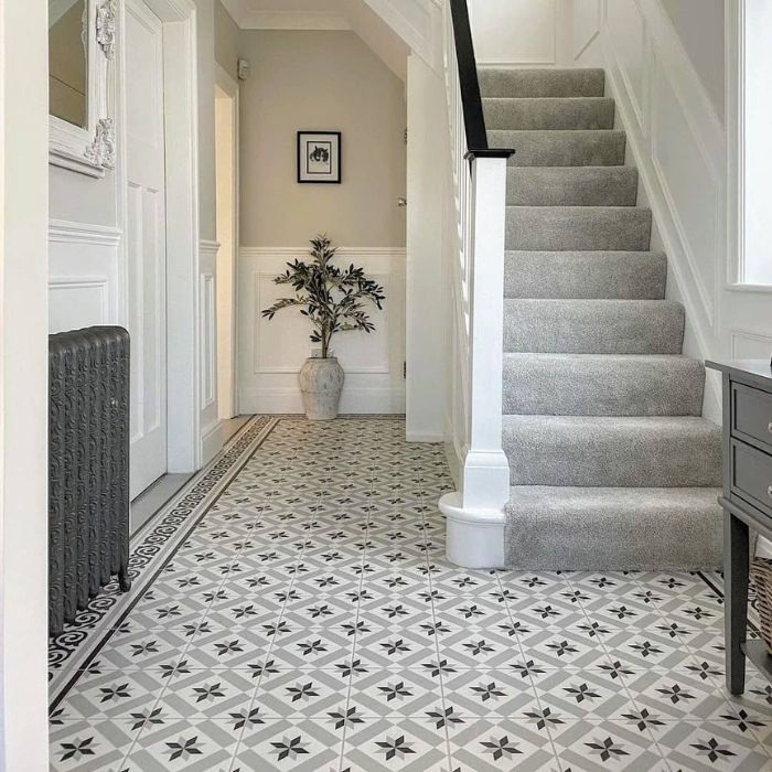 Chic hallway featuring intricate black and white Moroccan tiling