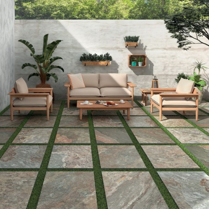 Charming patio setting with comfortable seating and beautiful garden tiles