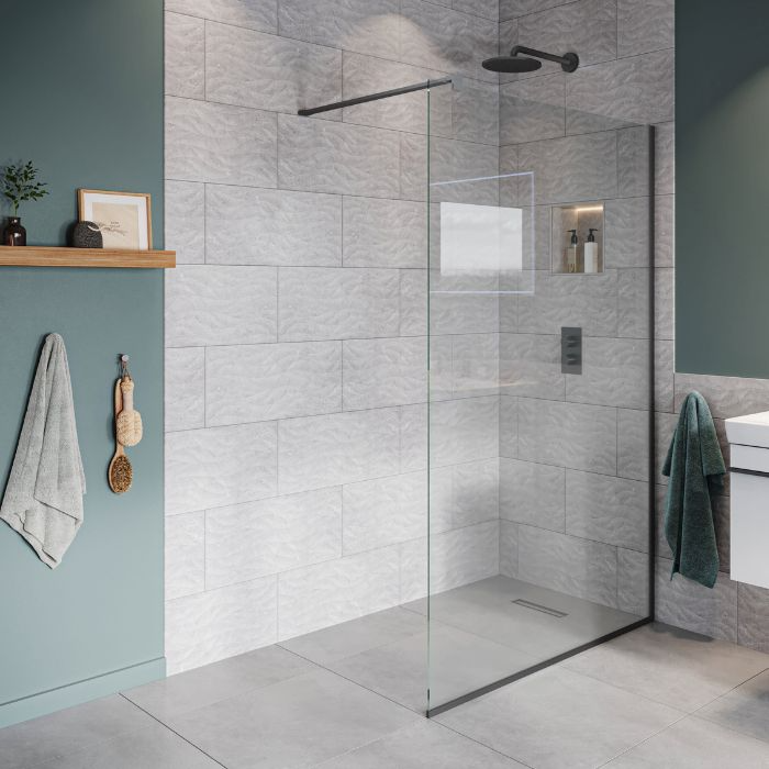 Stylish glass shower door in a modern bathroom, featuring elegant tiled walls