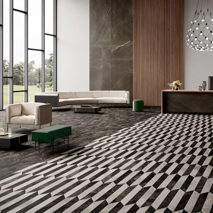 Monochromatic tiled lobby with dramatic floor-to-ceiling windows